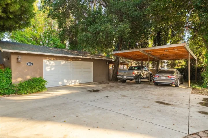 Oversized 2-car garage with carport parking