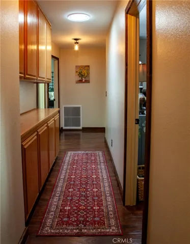 Hallway with lots of linen cabinets