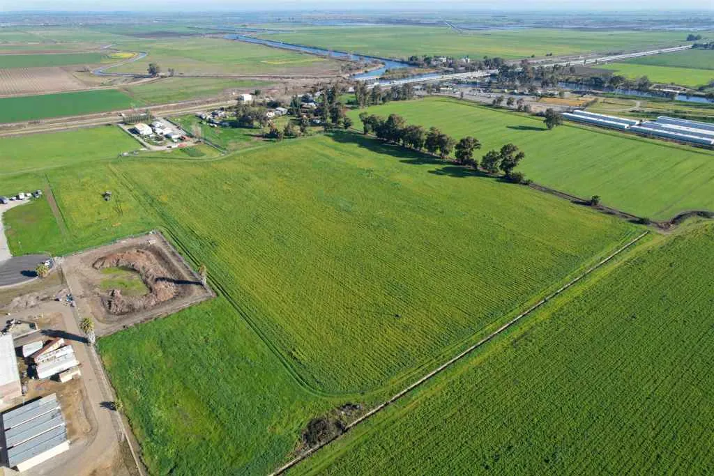 Aerial view of sparsely populated area with farmland