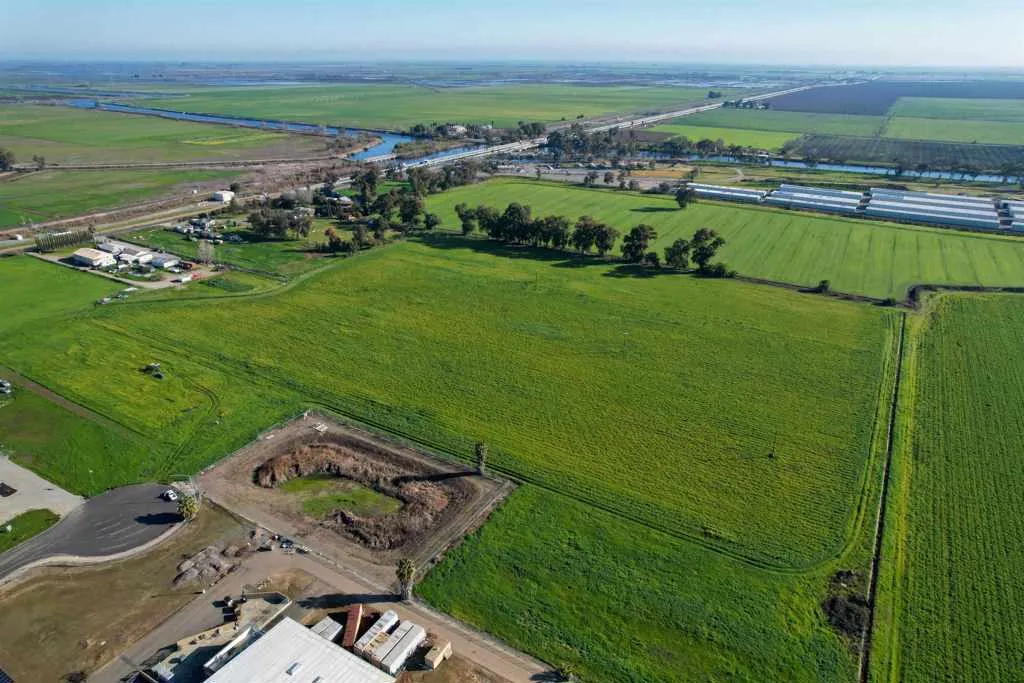 Aerial view of sparsely populated area featuring extensive farmland