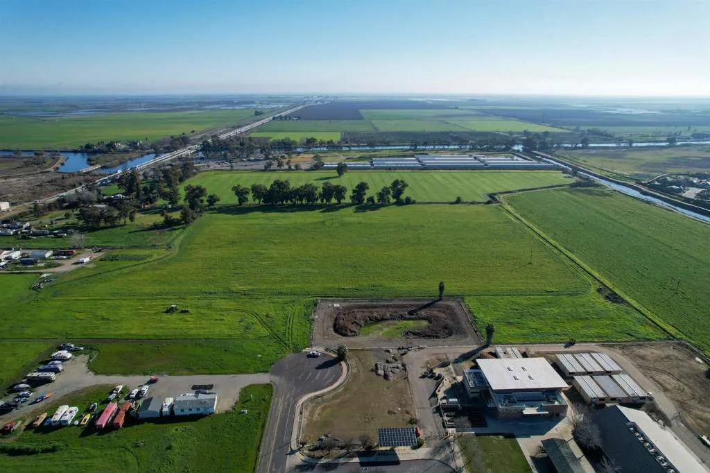 Aerial view of property and surrounding area with rural landscape and extensive farmland