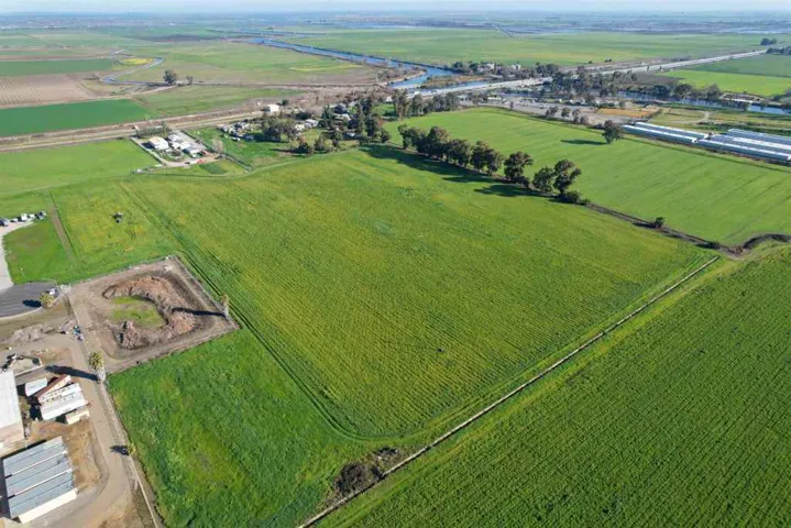 Aerial view of sparsely populated area with farmland