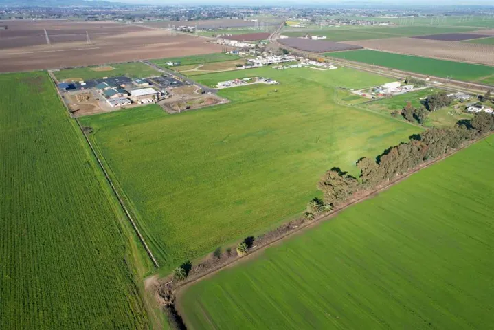 Overview of rural landscape featuring rows of crops