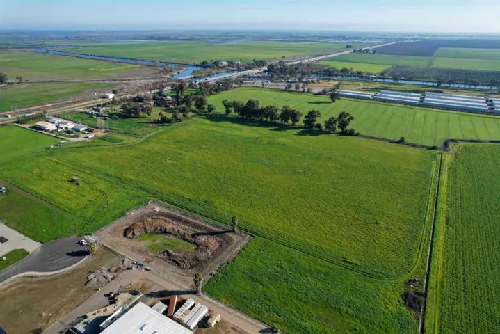 Aerial view of sparsely populated area featuring extensive farmland