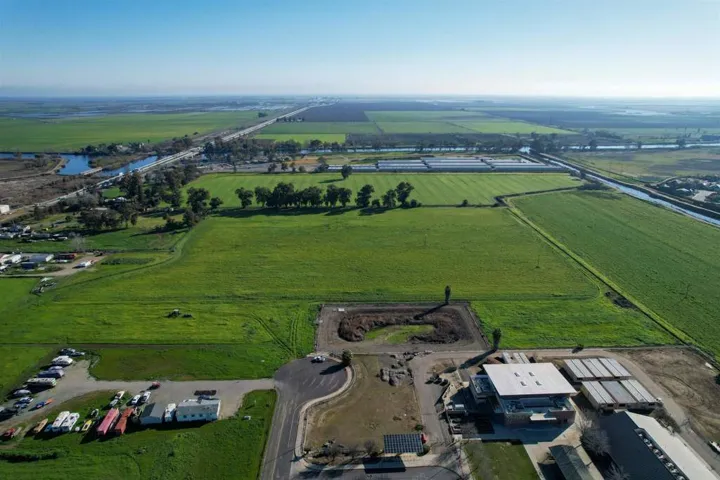 Aerial view of property and surrounding area with rural landscape and extensive farmland