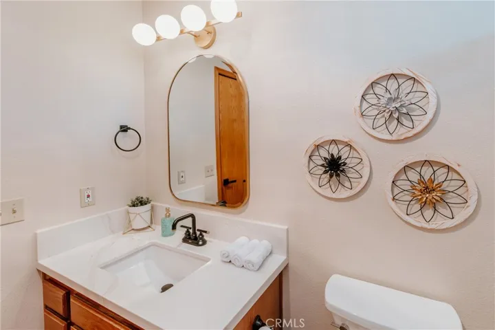 Upstairs bathroom with new countertops, lights, and more