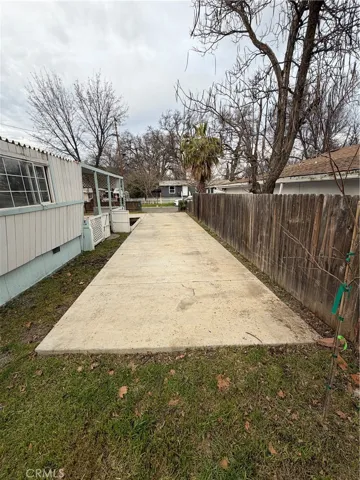 Paved driveway looking out toward walnut