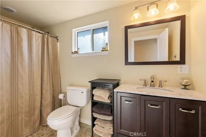 Down stairs bathroom with shower in tub