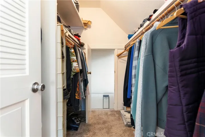 Master Bedroom Walk in closet with door in back that leads to hidden bonus room