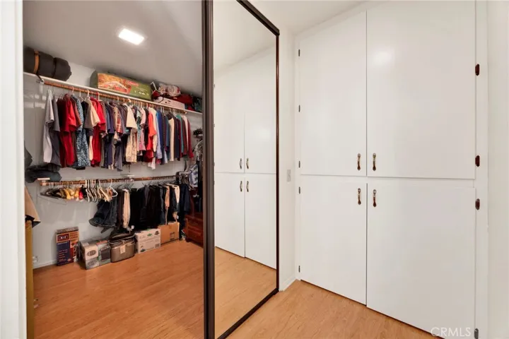 Primary bedroom walk-in closet