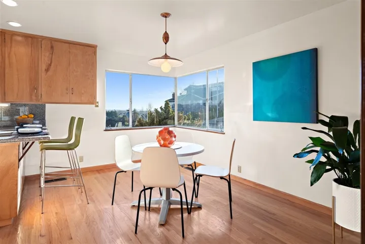 Dining area featuring light wood-type flooring and recessed lighting