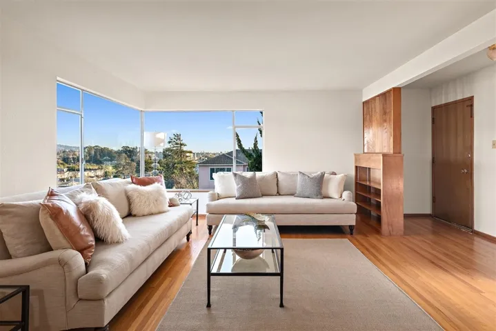 Living room featuring wood finished floors and baseboards