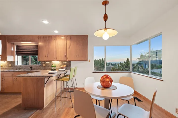 Dining space featuring light wood-style floors and recessed lighting