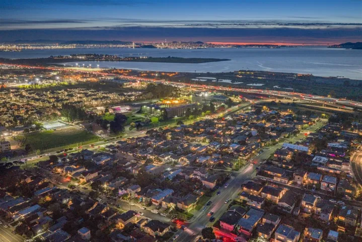 Aerial view of property's location featuring a nearby body of water