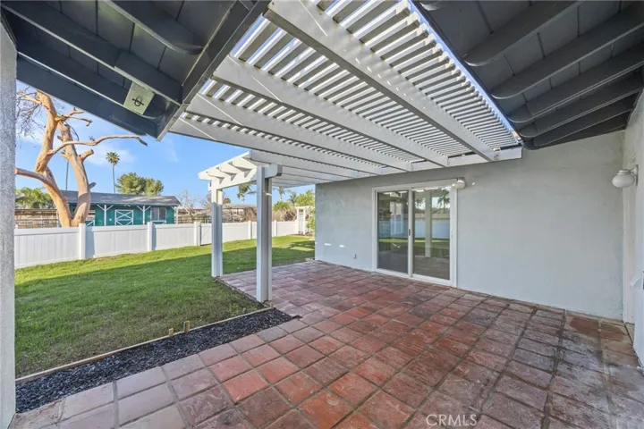 Patio shows access to backyard