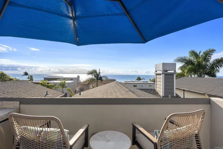 Lounging area, grill, refrigerator and sink located on this level