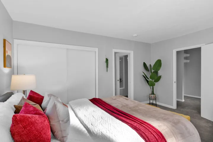 Bedroom featuring carpet flooring and a closet