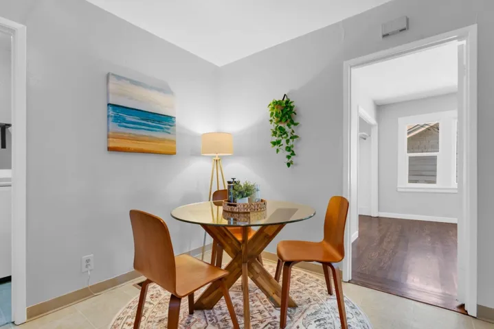 Dining area featuring baseboards and light tile patterned floors