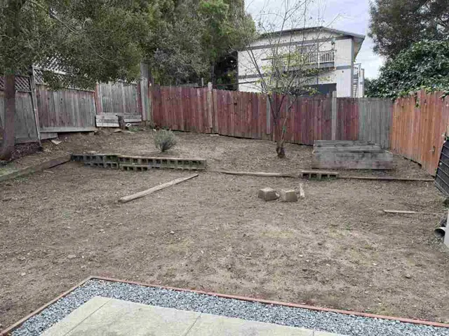 View of fenced backyard