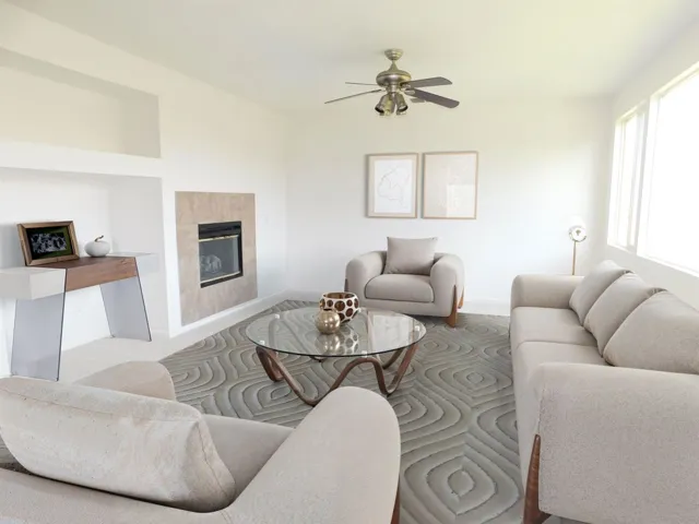 Living room featuring a fireplace and a ceiling fan  (Virtual Stage)