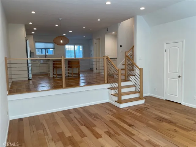 Living Room to Living Room Storage Closet & Upstairs Staircase