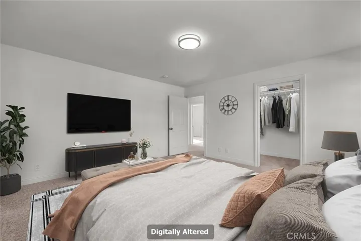 VIRTUALLY STAGED Primary Bedroom showing walk-in closet