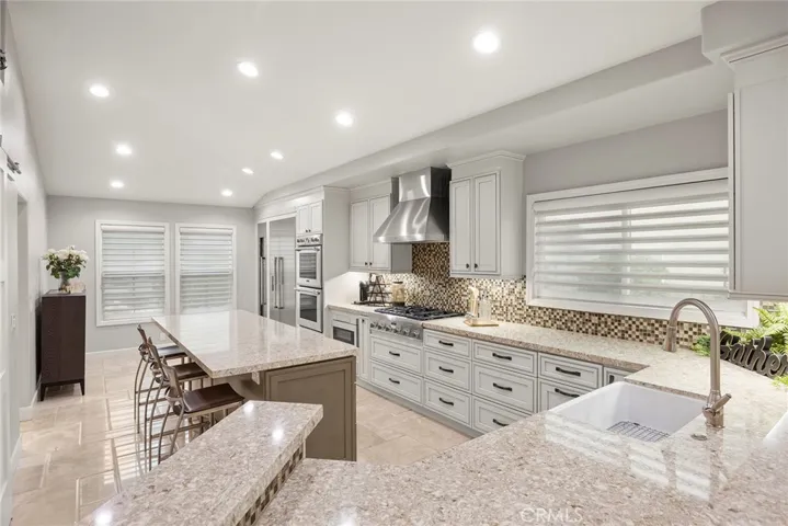 Quartz countertops and Glass Mosaic Backsplash