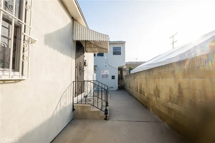 Walkway to Rear 2nd Building. Unit E Front entrance.