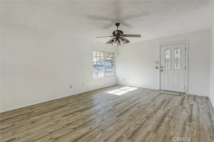 LIVING ROOM SHOWING FRONT DOOR