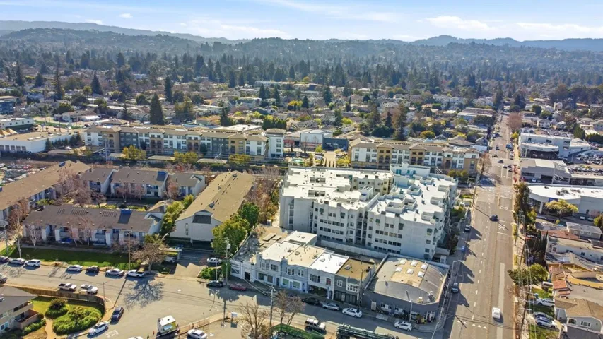 Aerial view of property's location with a mountainous background