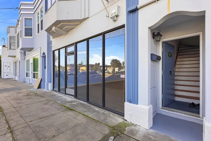 Property entrance featuring stucco siding