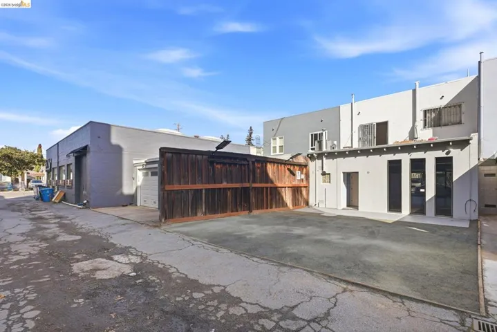 Rear view of property featuring stucco siding and a garage