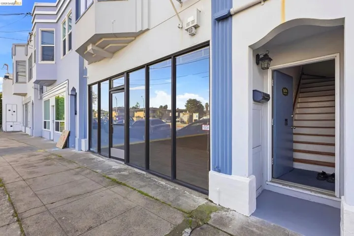 Property entrance featuring stucco siding