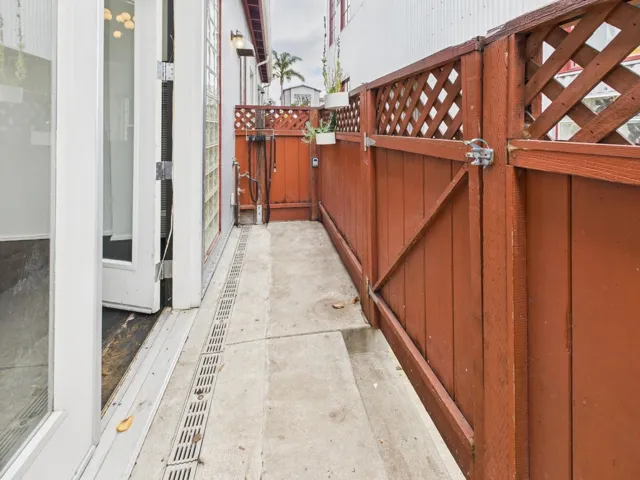 View of patio featuring a gate