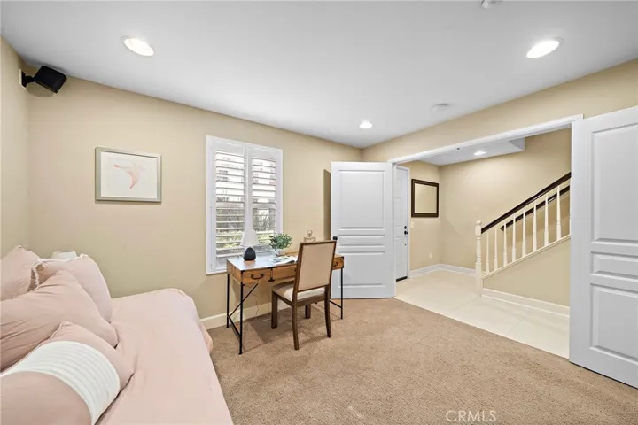 main floor bedroom wired for sound, recessed lighting, shutters, french doors