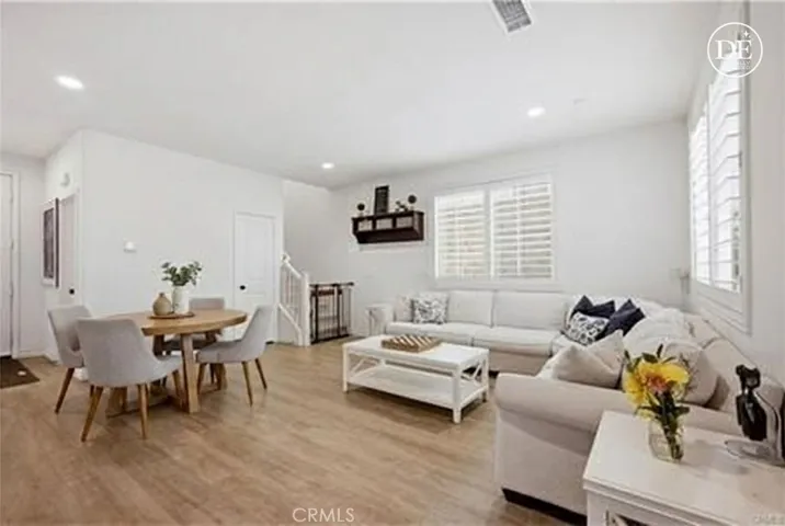 Digitally enhanced to show as living / dining combo