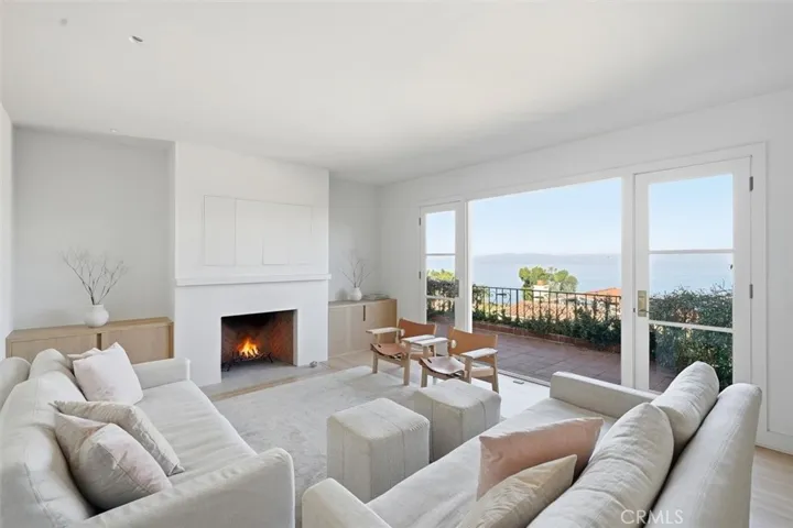 Living Room with fireplace and ocean views