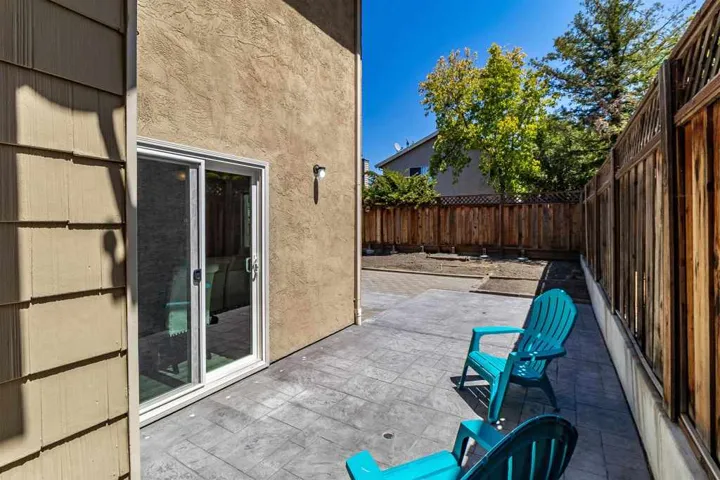Fenced backyard featuring a patio area