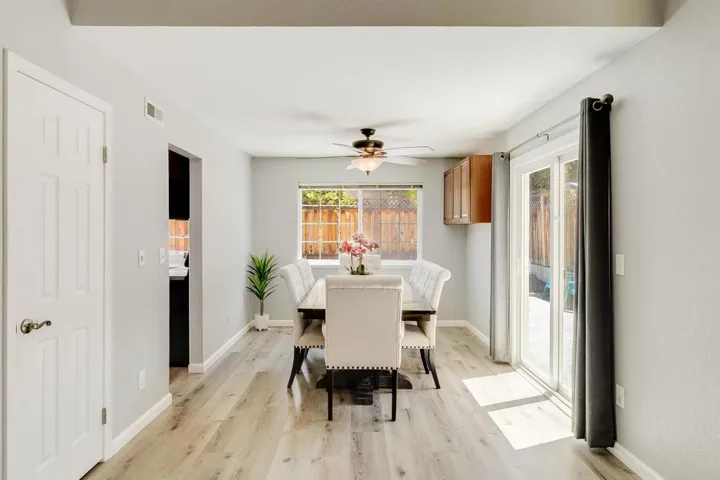 Dining space featuring light wood-style flooring and a ceiling fan