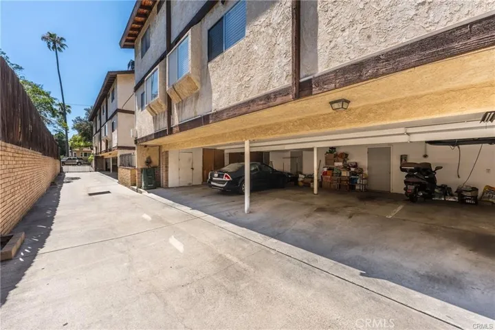 Gated driveway to carport