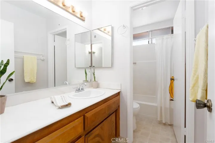 Full bath with water closet and tub shower Combo