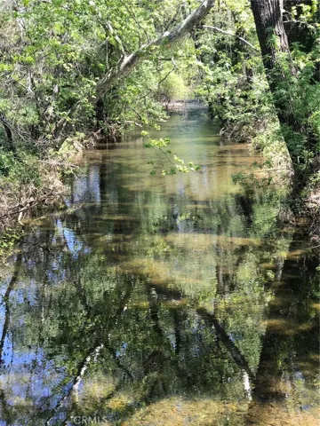 Seasonal Creek across the street, photo provided by Seller