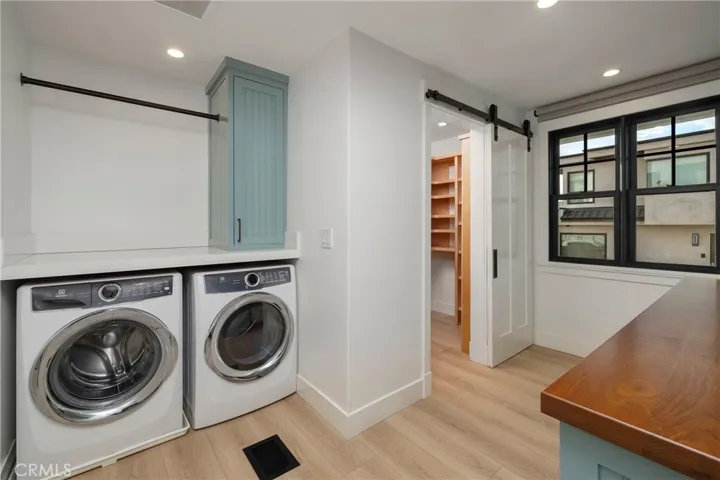 Laundry room with walk in pantry
