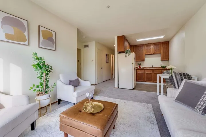 Living room featuring light carpet