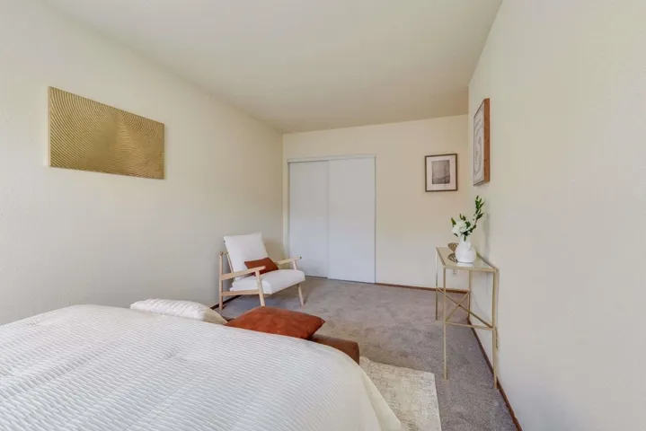 Bedroom with carpet floors and a closet