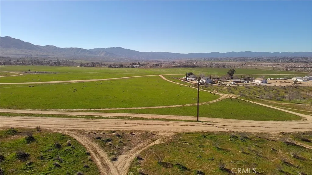 Showing vacant land on opposite side