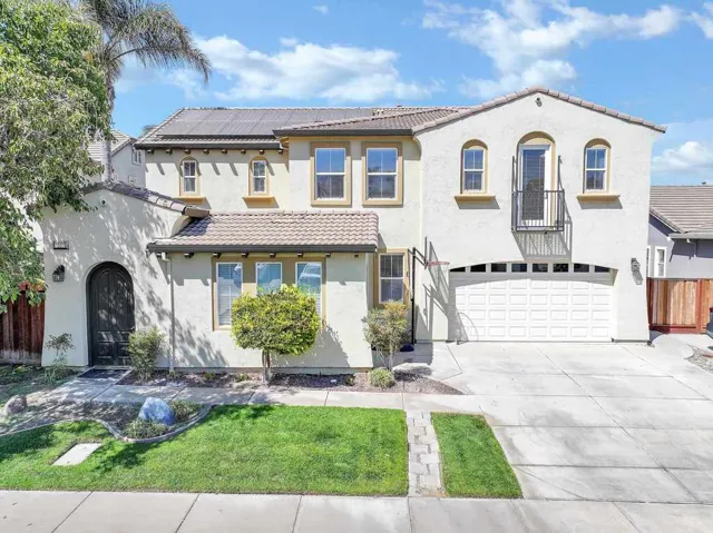 Mediterranean / spanish-style house featuring driveway, stucco siding, a garage, and a tile roof