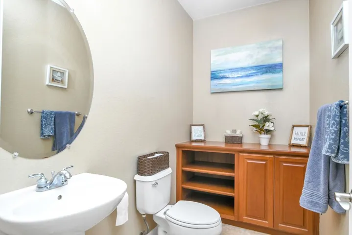 Bathroom featuring a sink and a textured wall