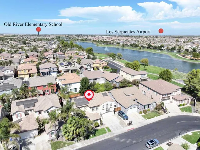 Aerial view of residential area with a nearby body of water