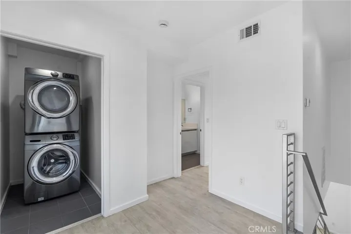  Laundry room with dryer and washer .